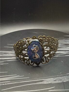 Antique Bronze Filigree Bracelet with Blue Cat Cameo Accent